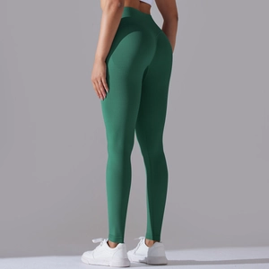 Detail view of seamless dark green ribbed leggings with scrunch butt lifting seam design