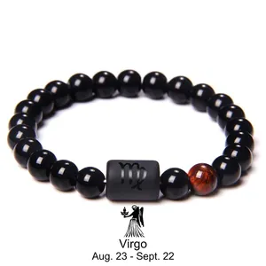 Detail of Virgo zodiac beaded bracelet with black onyx stones and red tiger eye gem