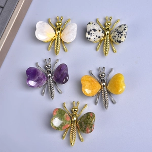 Five assorted natural crystal and metal butterfly ornaments featuring various gemstones