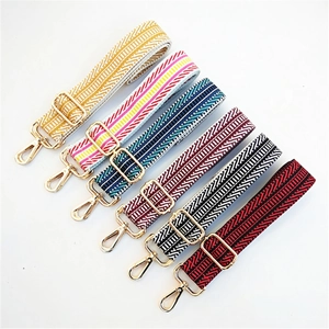 Wide colorful adjustable woven crossbody bag strap with geometric patterns and gold metal hooks