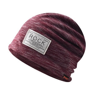 Detailed macro of burgundy knitted beanie featuring a Rock patch and Sport label detail