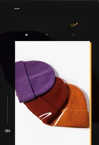 Close-up of knit texture on winter beanies in purple, burgundy and yellow