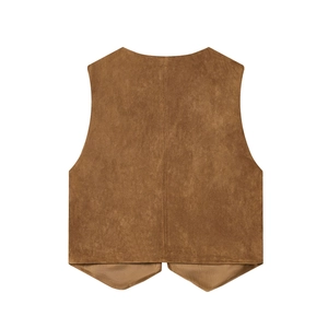 Détail de la texture en daim marron et broderie sur l'arrière de cette veste