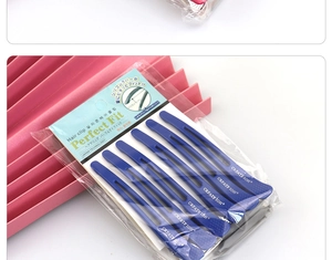 Detail showing a pack of 6 matte blue professional hair clips for sectioning and styling