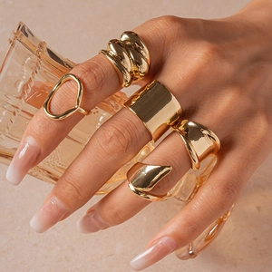 5-piece set of chunky gold geometric rings with textured and minimalist designs