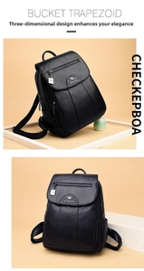 Detailed macro view of the front zipper pocket and metal kangaroo logo on black leather backpack