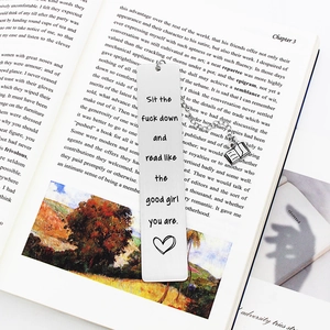 Polished stainless steel bookmark with book pendant and creative engraved text on a book