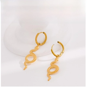 Macro shot of gold-plated stainless steel snake earrings with detailed scale textures