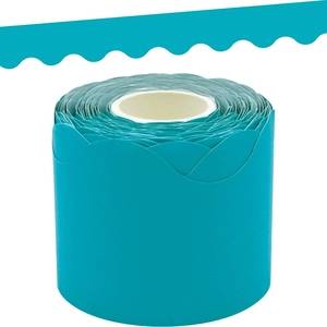 Close-up of bright cyan wavy border sticker roll for classroom bulletin board decoration
