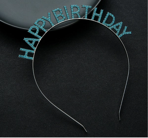 Detailed view of blue rhinestone Happy Birthday lettering on a thin metal headband