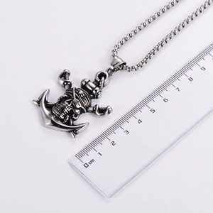 Men's silver pirate skull anchor pendant necklace with size scale on white background