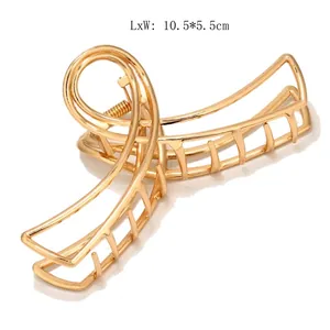 Golden butterfly metal hair claw clip size 10.5x5.5cm shown on white background