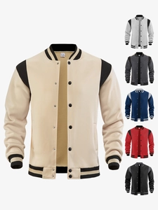 Detail of color-block varsity jacket featuring striped rib cuffs and multi-color swatches