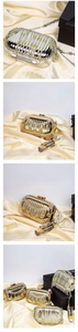 Detail of luxury acrylic evening bag with sparkling rhinestone fringe and metal chain strap