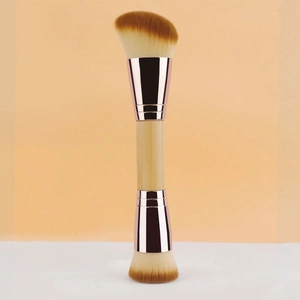 Dual-ended foundation brush with rose gold ferrule and dual synthetic bristle heads