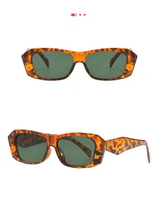 Close-up of geometric orange tortoiseshell sunglasses with dark green lenses and wide temples