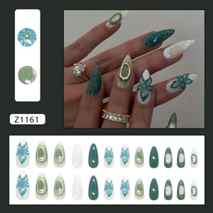 Morandi green and ink blue almond press-on nails with 3D floral and metallic ring accents