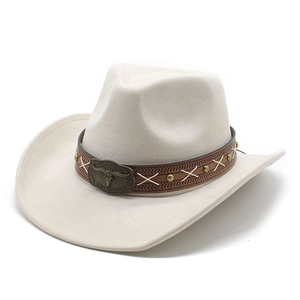 Close-up of beige suede cowboy hat featuring leather band and bronze bull head buckle