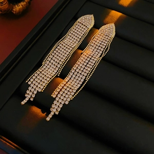 Exquisite long tassel drop earrings with sparkling rhinestones in a gold finish setting