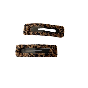 Set of two leopard print fabric hair clips with minimalist rectangular design for women