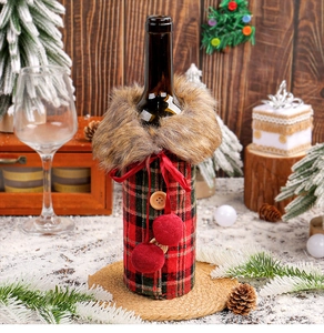 Detail of red and green plaid wine bottle cover with faux fur collar and wood buttons