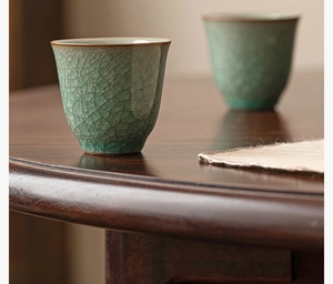 Detailed close-up of Ru kiln celadon tea cups with artistic ice crackle glaze texture