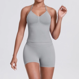Detail of gray seamless knitted yoga set showing rib-knit texture and halterneek design