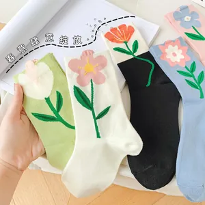Detailed knit cotton socks with colorful tulip and flower patterns in diverse soft colors