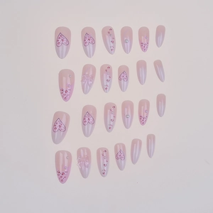 24 faux ongles amande dégradé rose avec nœuds, motifs léopard et perles décoratives