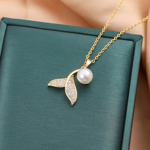 Elegant gold mermaid tail necklace with sparkling crystals and large pearl pendant