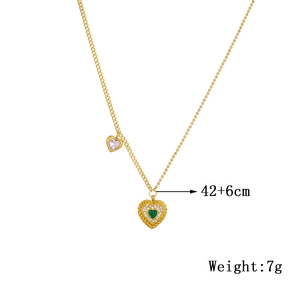 Detail of gold heart necklace with green gemstone, dimensions 42+6cm and 7g weight