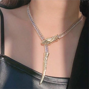 Sparkling gold snake pendant necklace with white crystals for a stylish adjustable look