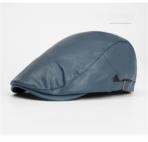 Detail of haze blue PU leather newsboy hat featuring fine texture and metal side buckle