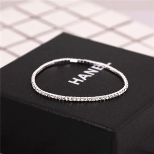 Detailed macro shot of 2mm single row silver rhinestone stretch tennis bracelet