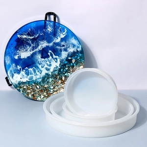 Set of translucent round silicone molds in various sizes for resin river table art creation