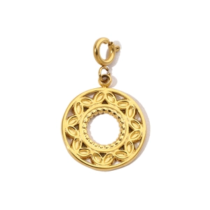 Close-up of golden hollow tree of life pendant with polished stainless steel surface