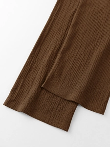 Macro shot of dark brown seersucker fabric texture and hem stitching on men's casual set