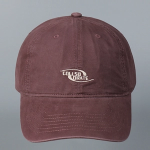 Close-up of burgundy washed cotton baseball cap featuring white Collaborate embroidery