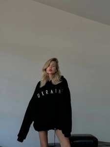 Oversized black hoodie for women featuring white Ukraine letter print in a loose fit