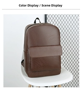 Detail view of large front flap pocket on a dark brown textured leather business backpack