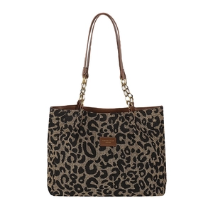 Vintage leopard print tote bag with brown leather handles and gold chain decoration