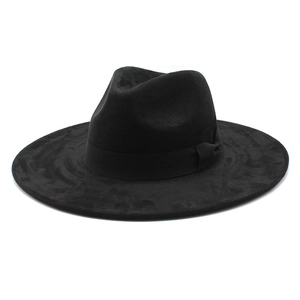 Close-up of black wool wide brim fedora hat with elegant ribbon and bow detail