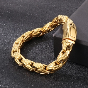 Close-up of a 10mm gold stainless steel curb chain bracelet for men with secure clasp