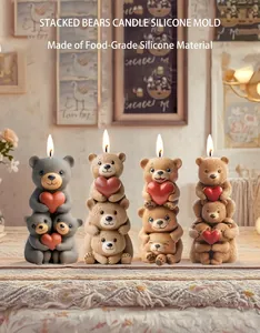 Detailed view of stacked bear candle silicone mold and finished food-grade resin casts