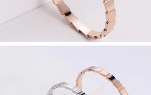 Detail of rose gold and silver bangle with geometric modular segmented design