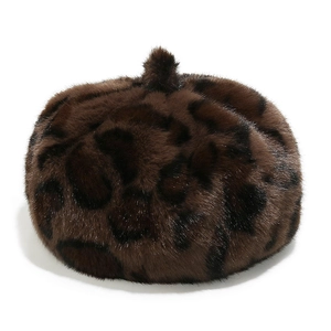Macro detail of the leopard print faux mink fur texture on a winter beret hat