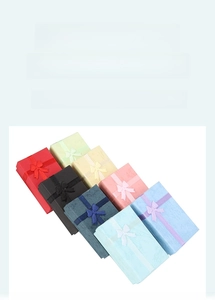 Selection of jewelry gift boxes with matching ribbon bows in multiple vibrant colors