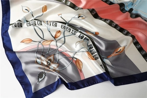 Detailed view of 90cm satin square scarf with floral calla lily patterns and silky texture