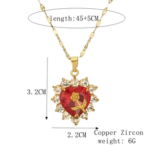 Detail view of heart necklace with red gem and gold rose motif, dimensions 3.2x2.2cm