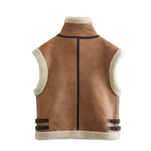 Detail of faux suede vest back with adjustable leather buckles and fleece lining